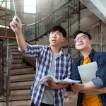 two-asian-interior-male-contractor-consult-examine-site-house-renovation-with-laptop-paper-drawingasian-engineer-designer-explain-discuss-site-constrction_609648-1144